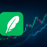 ロビンフッドを象徴する羽のマークと、仮想通貨を想起させる抽象的なチャートの背景
