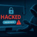ハッカーがパスワード入力画面に偽装したフィッシング攻撃を仕掛ける様子のイラスト