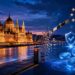 ハンガリー議会議事堂の夜景を背景に、仮想通貨規制の見直しとMiCAへの整合を表現したイメージ